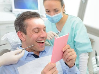 man smiling in mirror