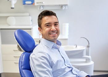 Man smiling in dental chair