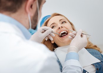 Senior woman receiving dental treatment