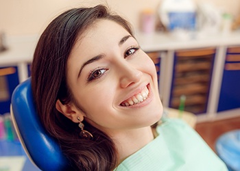 Smiling woman in dental chair