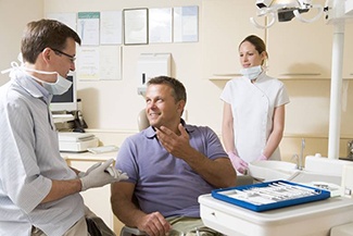 Man talking to dentist