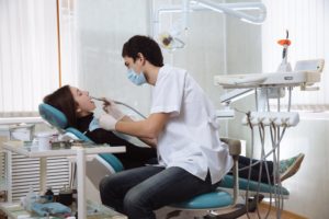woman relaxed in dental chair with sedation periodontist